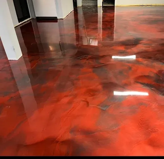 Red and black metallic epoxy floor coating with a high gloss mirror finish